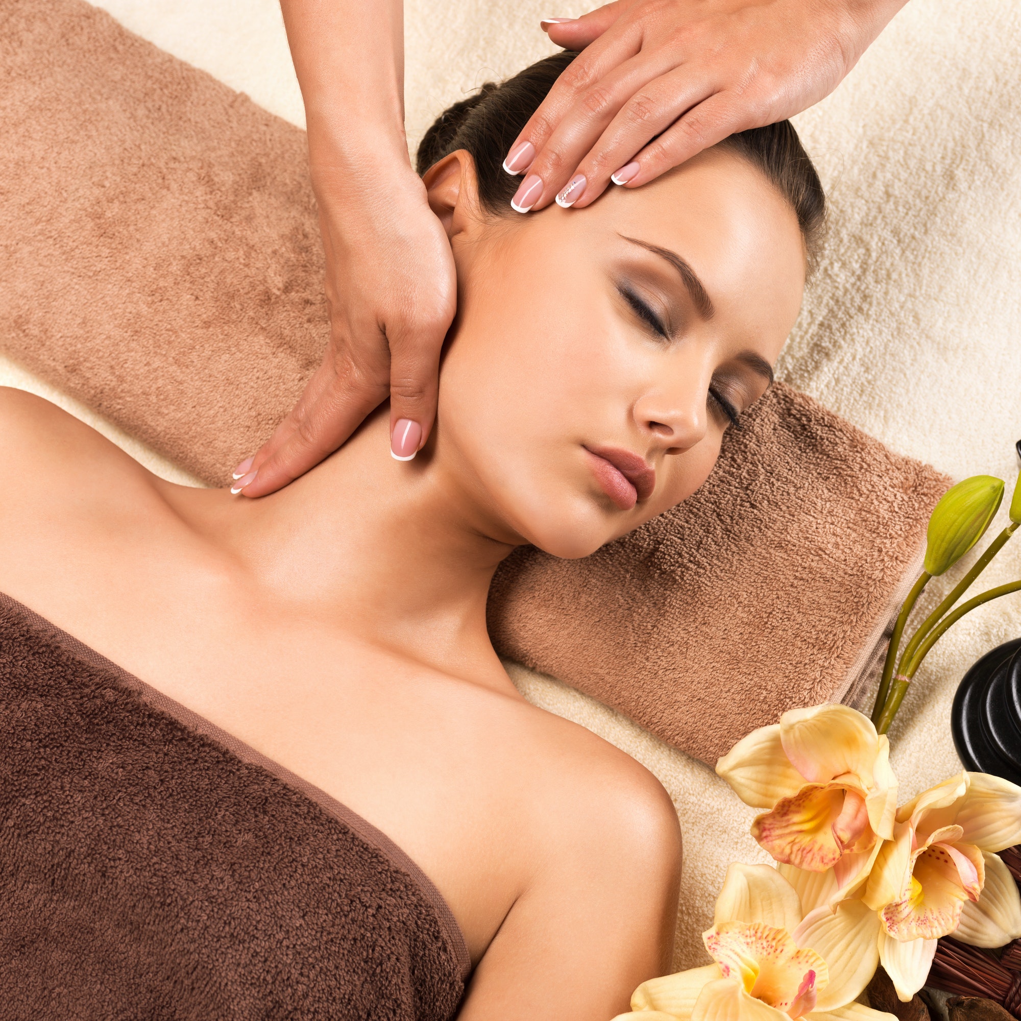 beautiful young woman relaxing with head massage